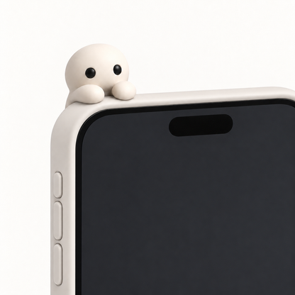 A Corbie sits in the seat on the top corner of a phone case, arms over the front edge, peeking over the top at the owner.