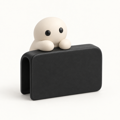 The Phone Perch in Black, a small matte black corner cap a Corbie lives on.