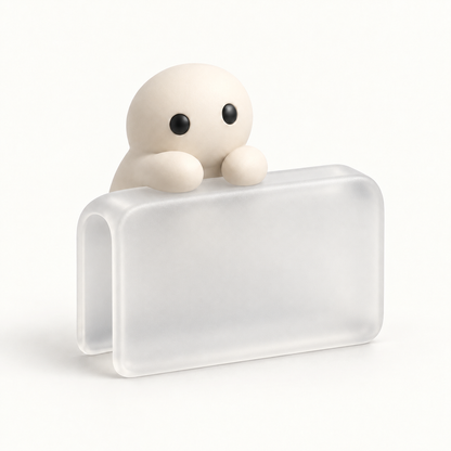 The Phone Perch in Clear, a small translucent corner cap a Corbie lives on.